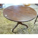 19TH CENTURY MAHOGANY CIRCULAR FLIP TOP TABLE ON SPREADING SUPPORTS