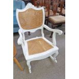 CONTINENTAL PAINTED BERGERE ROCKING CHAIR ON CABRIOLE SUPPORTS