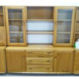 TEAK ERCOL CABINET WITH 2 GLASS PANEL DOORS AND SHELVED AREA OVER 3 DRAWERS AND 2 PANEL DOORS