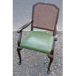 EARLY 20TH CENTURY MAHOGANY ARMCHAIR WITH BERGERE BACK ON CABRIOLE SUPPORTS