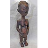 MENDE STANDING FEMALE FIGURE WEARING LOIN CLOTH,