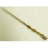 A 19TH CENTURY STILETTO WITH THIN TAPERING BLADE AND DECORATED BRASS HILT 15.