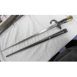 FRENCH M1874 GRAS BAYONET WITH 52 CM LONG BLADE WITH ETCHING TO SPINE IN ITS STEEL SCABBARD