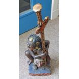 LARGE 19TH CENTURY BALINESE PAINTED WOODEN KRIS STAND DEPICTING MYTHICAL FIGURE SEATED ON AN ANIMAL,