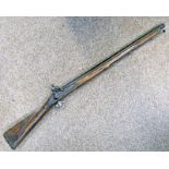 A 19TH CENTURY PERCUSSION CARBINE CONVERTED FROM FLINTLOCK WITH BRASS MOUNTS AND TRIGGER GUARD AND