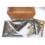 SELECTION OF EARLY 20TH CENTURY METAL SHELF BRACKETS IN A WOODEN DRAWER