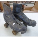 PAIR OF LEATHER ROLLER SKATES