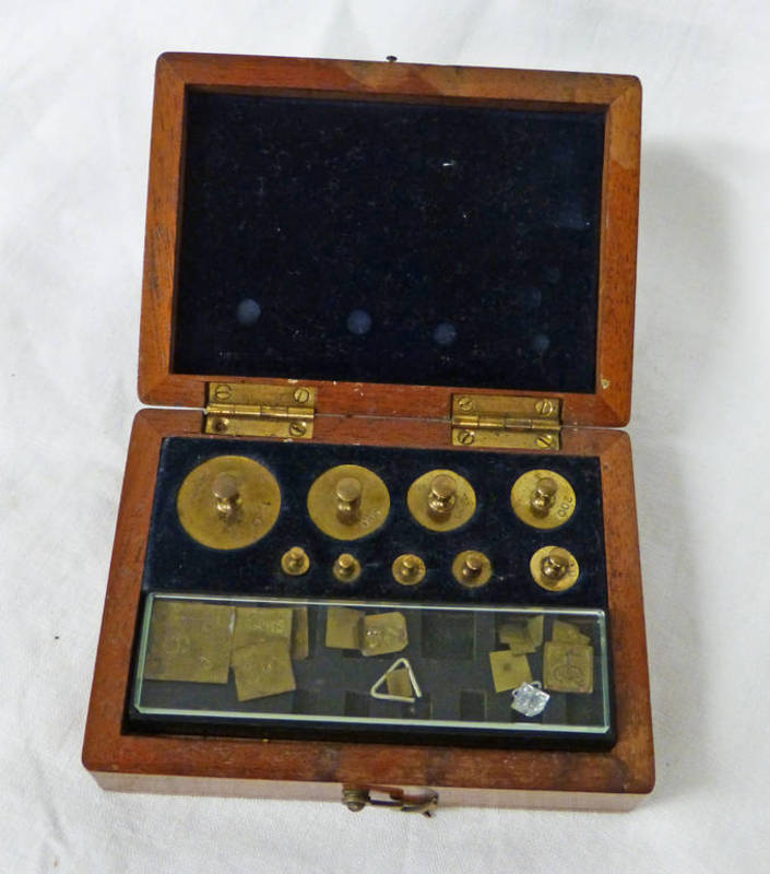 MAHOGANY CASED SET OF BRASS WEIGHTS