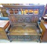 LATE 19TH CENTURY OAK HALL BENCH WITH CLASSICAL SCENE CARVED DECORATION