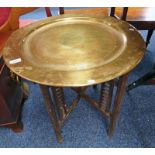 CIRCULAR TOPPED BRASS TABLE ON FOLDING BASE