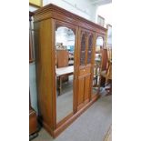 EARLY 20TH CENTURY WALNUT WARDROBE WITH 2 MIRROR DOORS FLANKING CARVED PANEL DOOR - 184CM LONG