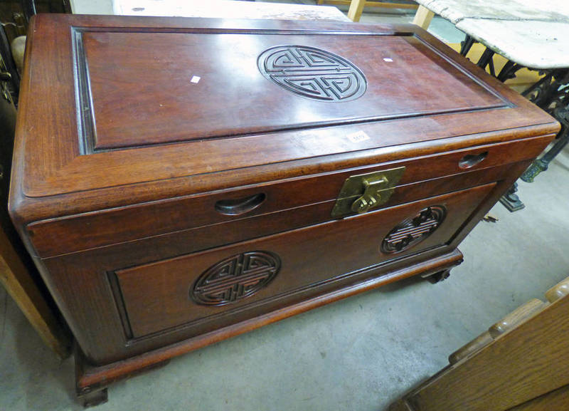 ORIENTAL TRUNK WITH LIFT UP LID & CARVED DECORATION.