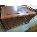 ORIENTAL TRUNK WITH LIFT UP LID & CARVED DECORATION.