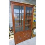 ORIENTAL CABINET WITH 2 GLASS PANEL DOORS OVER 2 CARVED PANEL DOORS & SHELVED INTERIOR.