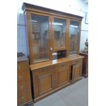 LATE 19TH CENTURY WALNUT BOOKCASE WITH 3 GLAZED DOORS OVER 3 DRAWERS OVER 3 PANEL DOORS ON PLINTH