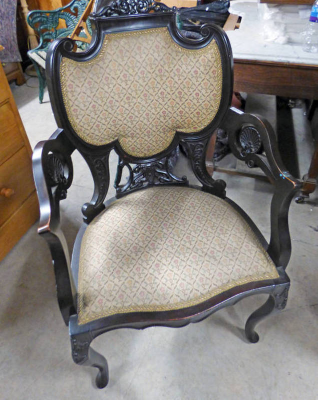 LATE 19TH CENTURY EBONISED OPEN ARMCHAIR ON CABRIOLE SUPPORTS