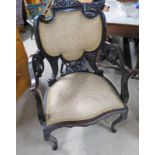 LATE 19TH CENTURY EBONISED OPEN ARMCHAIR ON CABRIOLE SUPPORTS