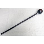 LATE 19TH CENTURY HARDWOOD ZULU KNOBKERRIE WITH LARGE GLOBULAR HEAD AND TAPERING SHAFT 73 CM LONG