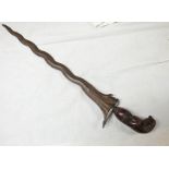 MALAYAN KRIS WITH 35CM LONG WAVY BLADE AND INTERESTING CARVED GRIP IN THE FORM OF TRIBESMAN