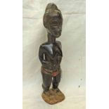 BAULE FEMALE STANDING FIGURE WITH FINE COIFFURE TO HEAD,