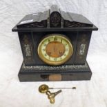 BLACK SLATE MANTLE CLOCK WITH HARDSTONE INSERTS AND WHITE METAL PLAQUE THAT READS 'PRESENTED ALONG