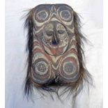 NEW GUINEA SEPIK RIVER RED & WHITE ANCESTRAL SPIRIT BOARD WITH WOVEN GRASS NOSE AND EYES & FEATHER