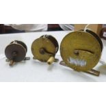 THREE BRASS WINCH REELS: A 2 7/8 INCH CHARLES FARLOW (HANDLE MISSING),