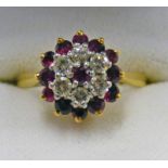 DIAMOND AND RUBY SET CLUSTER RING IN SETTING MARKED 18CT AND PLAT