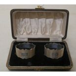 CASED SET OF 2 SILVER NAPKIN RINGS WITH ENGINE TURNED DECORATION & DECORATIVE EDGING,