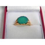 OVAL GREEN STONE RING IN SETTING MARKED 18CT