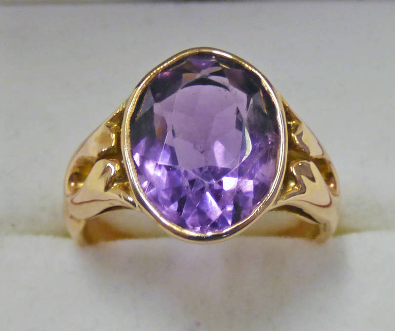 OVAL AMETHYST SET RING MARKED 585 Condition Report: Ring size: N. Chip to the culet.