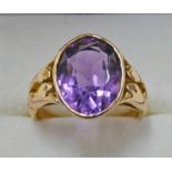 OVAL AMETHYST SET RING MARKED 585 Condition Report: Ring size: N. Chip to the culet.