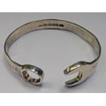 SILVER BANGLE WITH SPANNER & KEY DECORATION,