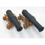 PAIR OF REPRODUCTION CAST IRON BRITISH NAVAL CANNON, BOTH WITH 39.