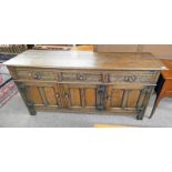 20TH CENTURY OAK DRESSER BASE WITH 3 DRAWERS WITH CARVED DECORATION OVER 3 PANEL DOORS,