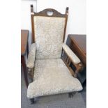 LATE 19TH CENTURY OR EARLY 20TH CENTURY OAK ARMCHAIR WITH CARVED DECORATION ON TURNED SUPPORTS