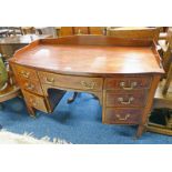 LATE 19TH CENTURY MAHOGANY BOW FRONT DESK WITH GALLERIED TOP,