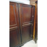 MAHOGANY HALL CUPBOARD WITH PANEL DOOR ON BRACKET SUPPORTS