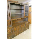 OAK CABINET WITH LEADED GLASS DOOR & SHELVED AREA WITH 3 DRAWERS BELOW & 3 PANEL DOORS WIDTH 143CMS