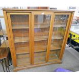 LATE 19TH CENTURY OAK BOOKCASE WITH 3 GLASS SLIDING DOORS OPENING TO SHELVED INTERIOR,