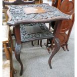 EARLY 20TH CENTURY CARVED WALNUT OCCASIONAL TABLE WITH UNDERSHELF AND SHAPED SUPPORTS