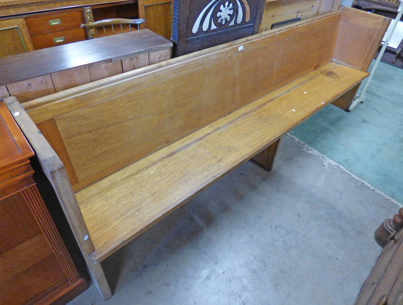 EARLY 20TH CENTURY PEW WITH DECORATIVE CARVED END .