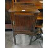 MAHOGANY CABINET WITH PANEL DOOR ON SQUARE SUPPORTS