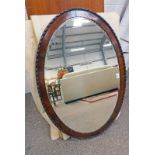 EARLY 20TH CENTURY MAHOGANY OVAL FRAMED BEVELLED EDGE MIRROR,