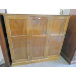 LATE 19TH CENTURY MAHOGANY CABINET WITH 3 PANEL DOORS OPENING TO DRAWERS & RAILED INTERIOR
