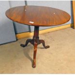 19TH CENTURY MAHOGANY CIRCULAR FLIP TOP TABLE WITH TURNED COLUMN AND SPREADING SUPPORTS