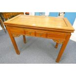 ORIENTAL MAHOGANY TURNOVER TABLE ON 4 SQUARE SUPPORTS WITH DRAWERS,