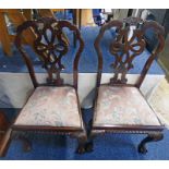 PAIR OF MAHOGANY CHAIRS WITH DECORATIVE CARVED BACK AND SHAPED SUPPORTS