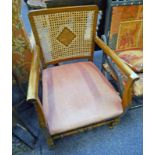 MAHOGANY FRAMED BERGERE CHAIR ON TURNED SUPPORTS