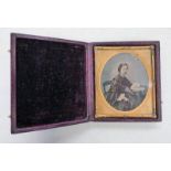 GILT FRAMED OVAL AMBROTYPE OF A YOUNG WOMAN IN A BLACK DRESS AT A DESK WITH BOOKS 6.7 X 5.
